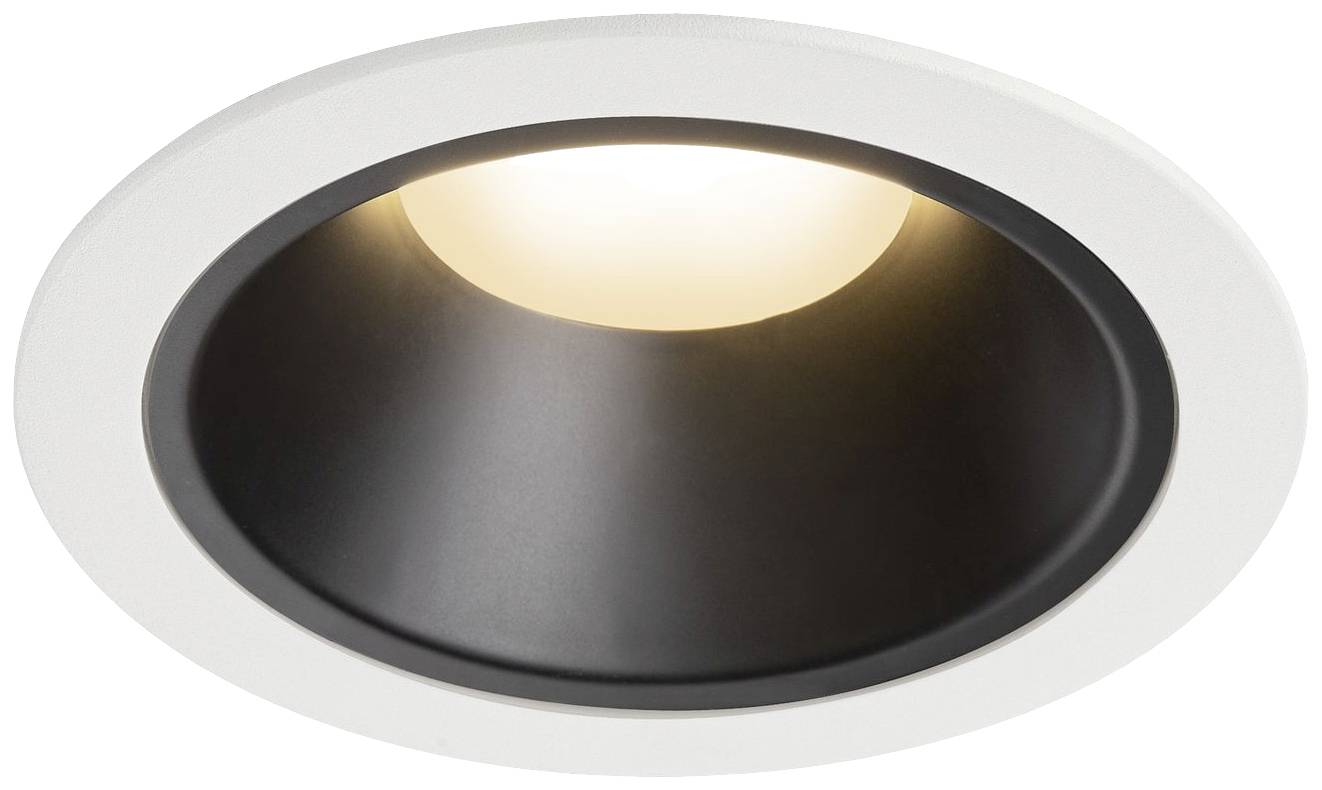 Round, recessed ceiling light with a white border and black interior, which radiates a warm light downwards.