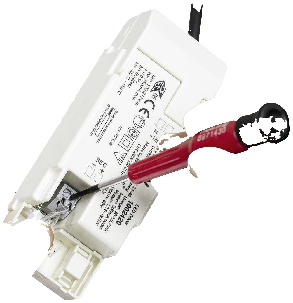 An electronic transformer with a screwdriver making an adjustment. Various technical symbols and specifications are visible.