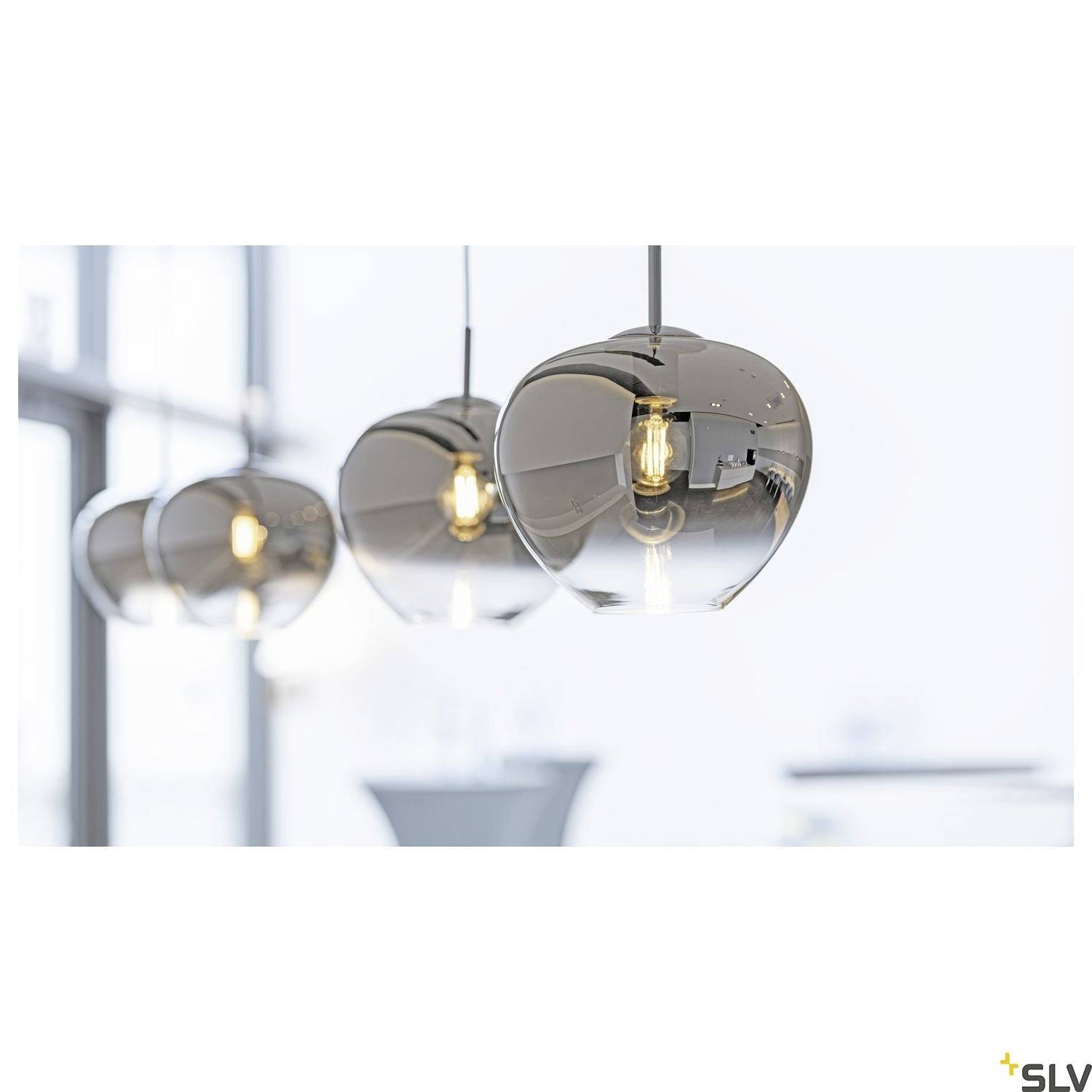 Three modern, hanging lamps with gleaming, metallic surfaces and visible light bulbs in a bright room.