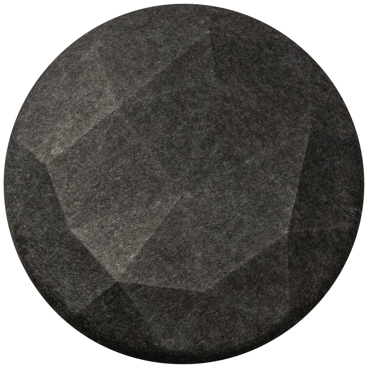 A darker, faceted stone or metal piece with irregular edges, circular and gleaming.