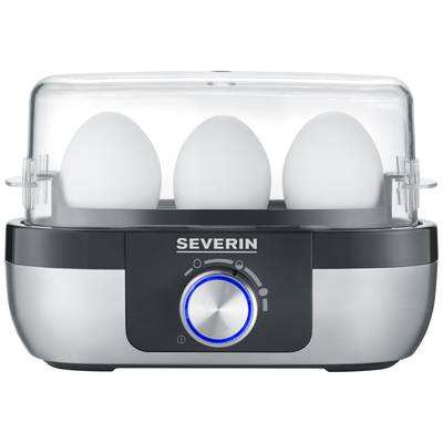 An egg boiler with a transparent lid, containing three white eggs. The device is black and silver with a blue control button.