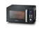 Black microwave with digital time display, multiple control buttons on the side and illuminated interior, with a pizza inside.