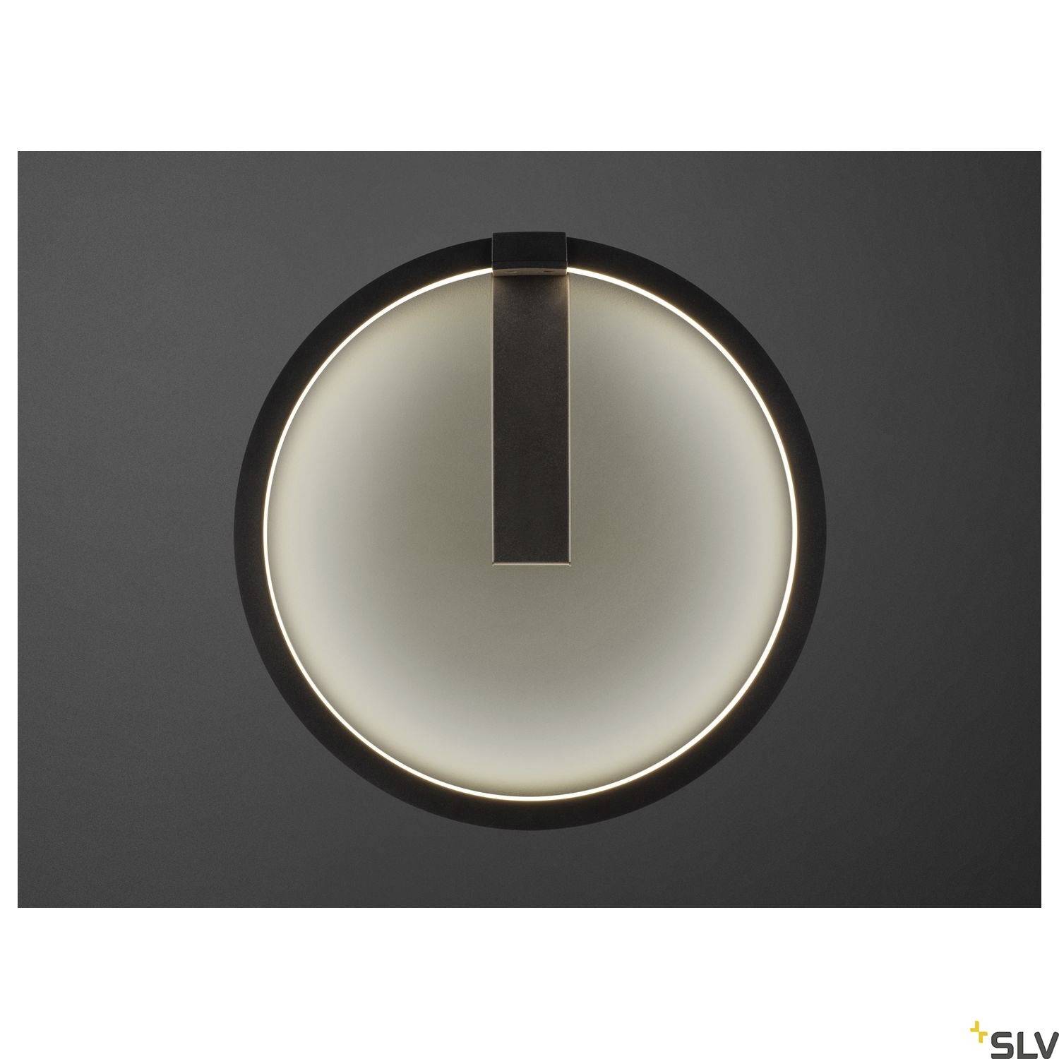 Black, circular wall light with inner halo on grey background, modern design, suitable for contemporary interiors.