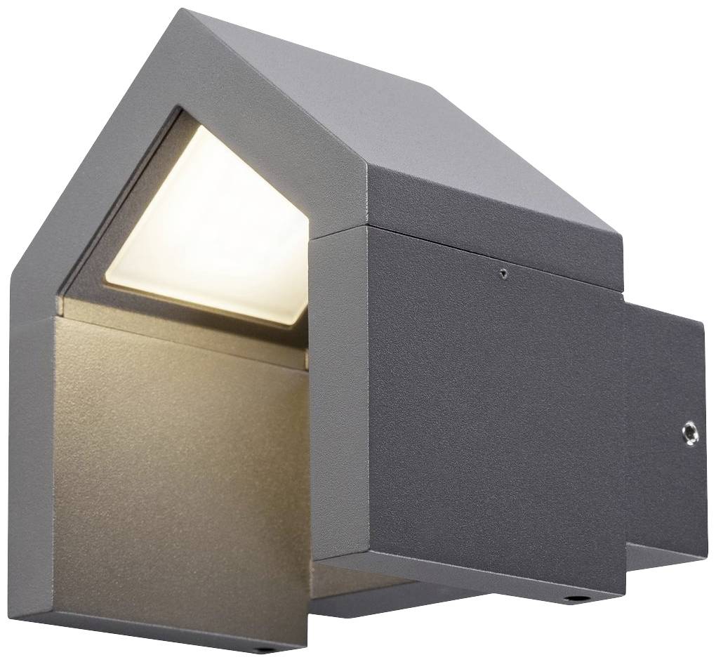 Modern outdoor light in dark metal, cubic in shape with an angled roof, emitting downward-directed light. Suitable for exterior walls.