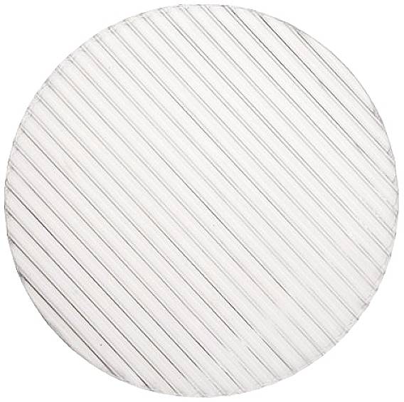 A circular, white surface with diagonal, parallel lines forming a structured pattern.