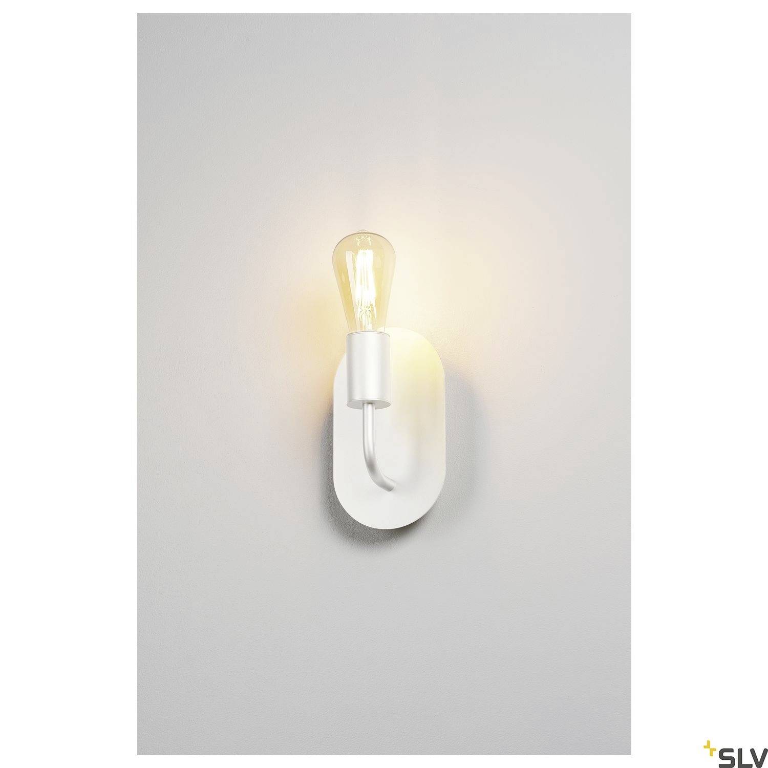 White wall light with visible light bulb, radiating warm light. The lamp has a simple, modern design and illuminates a wall.