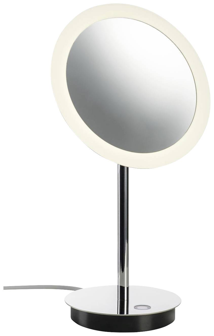 A round, illuminated make-up mirror stands on a metallic base with a slender stem. A cable is connected to the base.