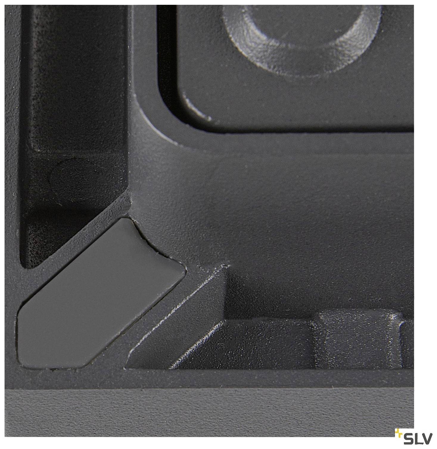 Close-up of a black rectangular object with recessed edges and an SLV brand logo in the bottom right corner.