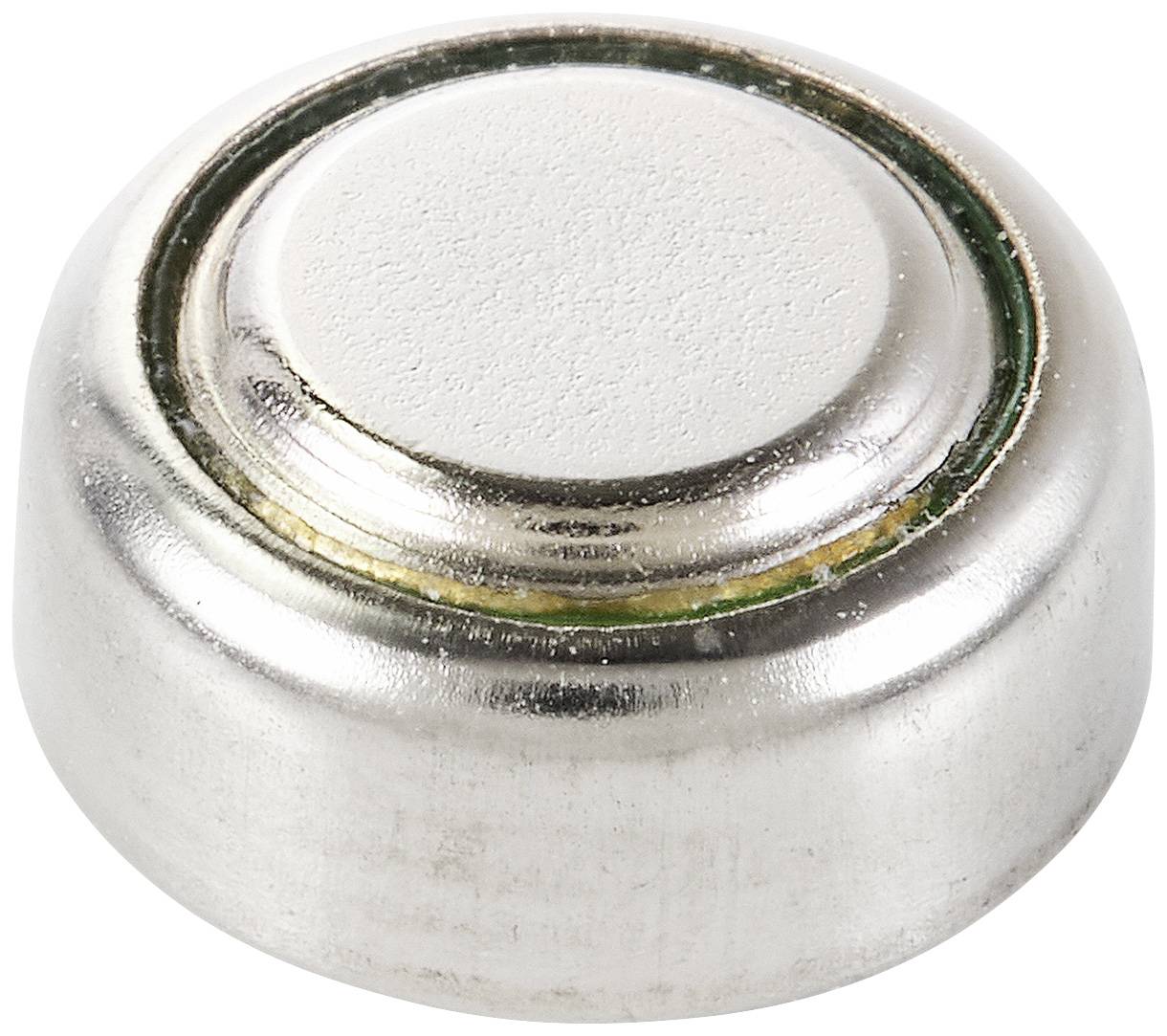 'Close-up of a silver button cell battery, lying on a white surface.'