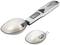 Digital measuring spoon scales with removable spoons, LCD display showing 22 g. Ideal for precisely measuring small quantities.