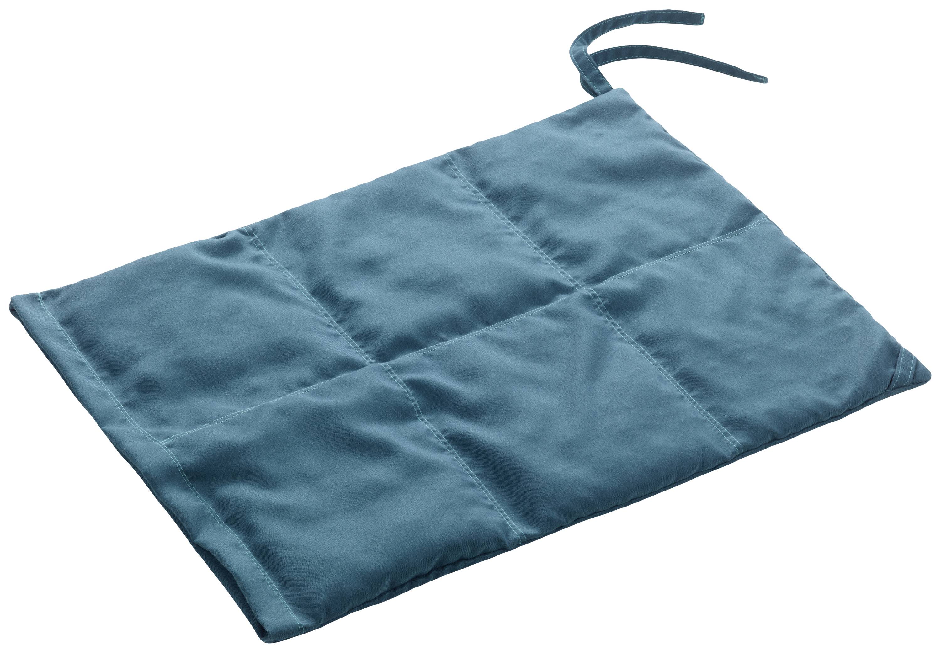 A blue, woven rectangle with a square pattern and a ribbon at one corner.