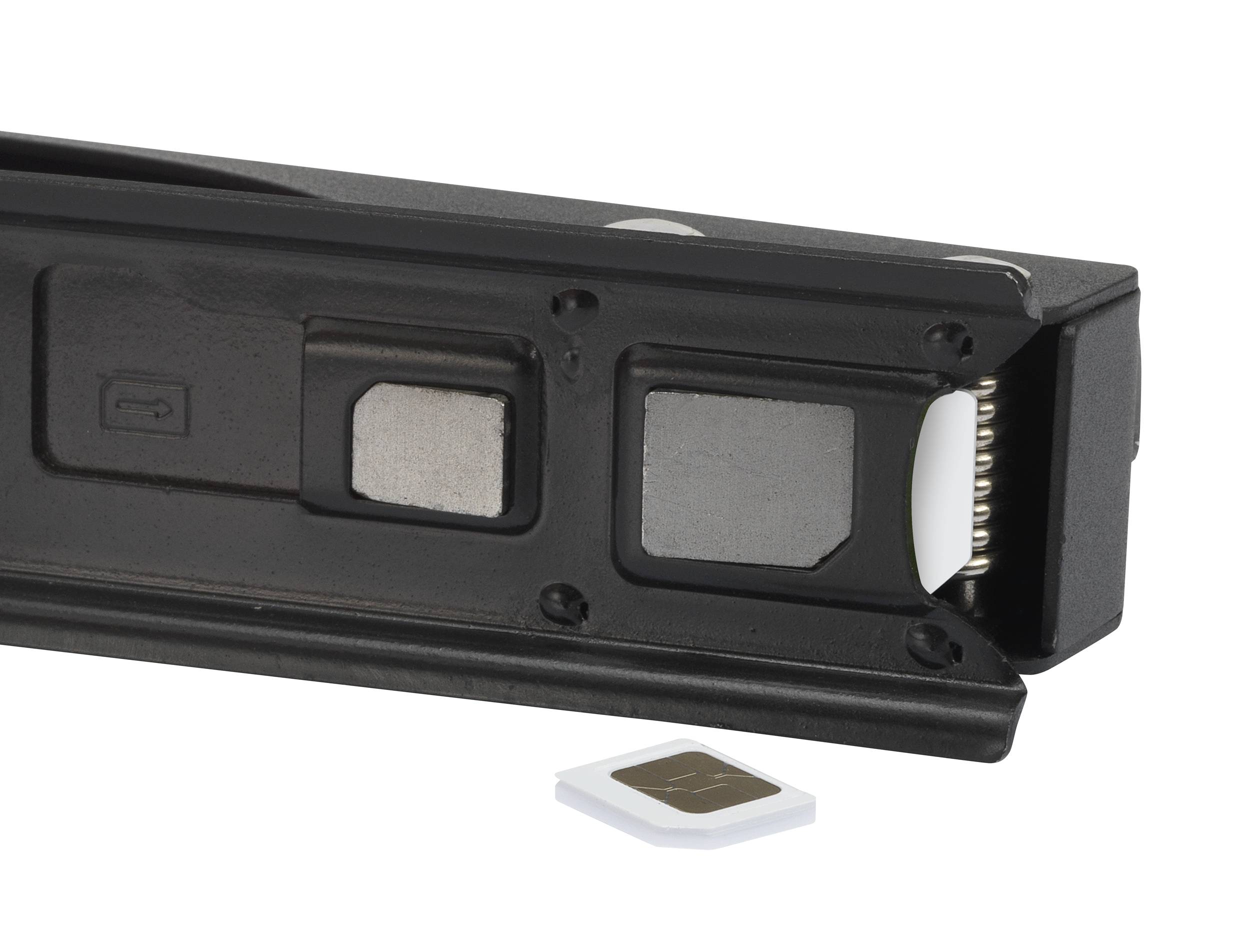 A black SIM card holder with a removable SIM card is lying on a white surface.