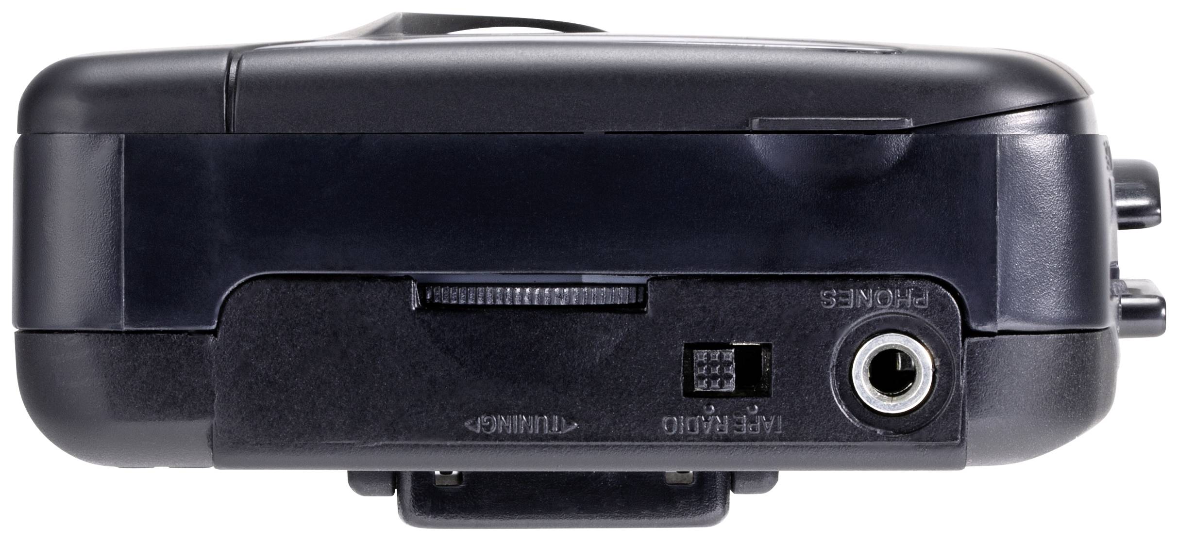 A black portable cassette recorder is seen from above, with connection sockets and a volume control on the side.