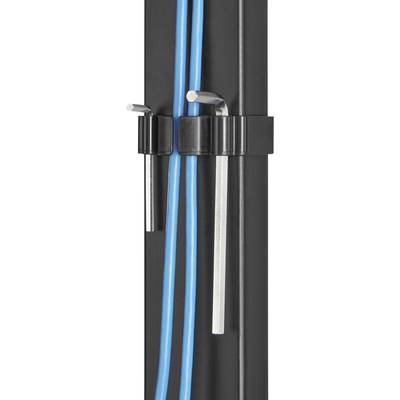 A black cable management clip on a table leg holds two blue cables and two hexagonal keys.