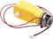 A yellow electric motor with two wires (red and black) and a white plastic gear attachment, commonly used in robotics.