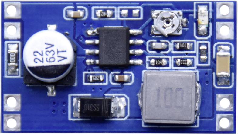 Small, rectangular blue circuit board with multiple electronic components and labelling.