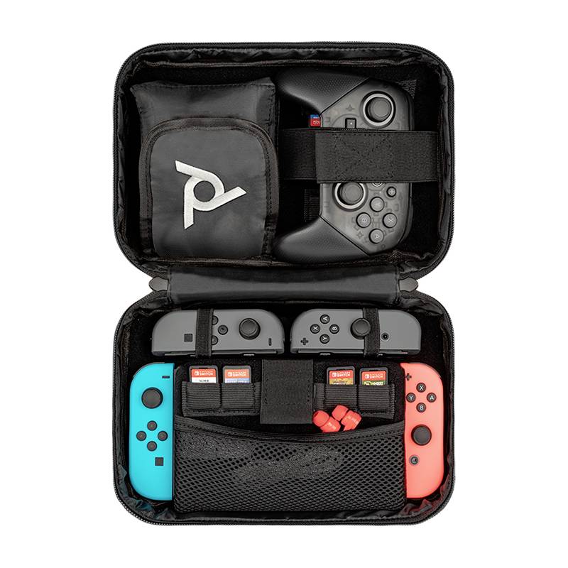 An open black suitcase displays various game controllers, modules and accessories, neatly arranged in compartments.