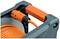 An orange cable is wound onto a black cable drum. The drum has a carrying handle and a plug connection.
