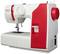 Sewing machine with red accents, brand name 'Veritas'. It features a numerical dial for stitch settings and a thread input facility.