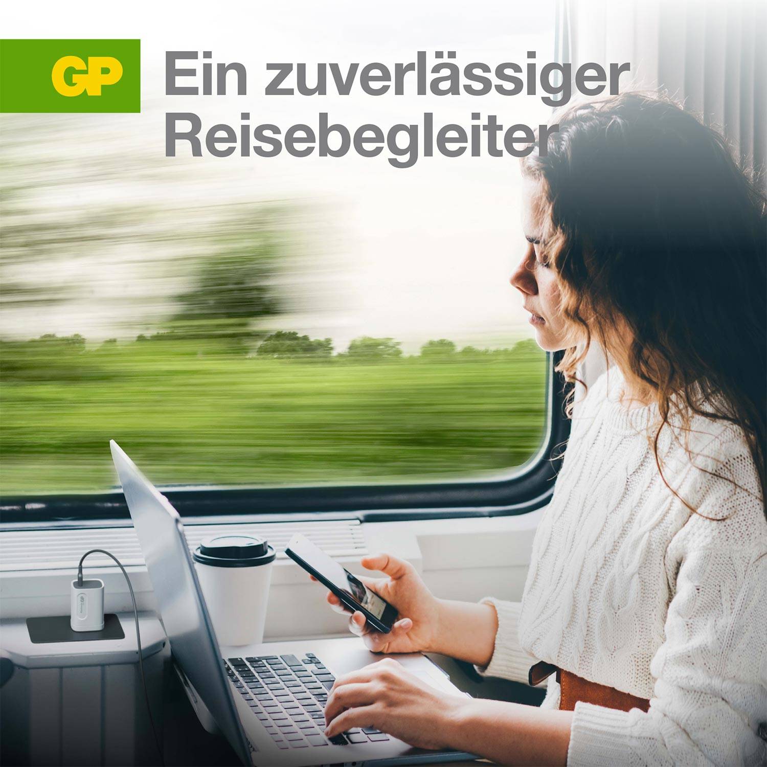 Woman in clothing with laptop and smartphone on a train, symbolising eco-friendly travel. Text 'A reliable travel companion'.