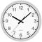 Analogue wall clock with a white face, black numbers, and hands. The clock shows 10:10.
