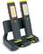Two portable LED work lights from Philips are standing in a charging station. They are black with yellow accents and have display indicators.