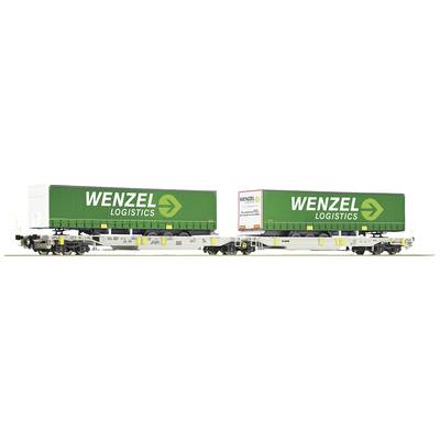 Two green freight train containers from Wenzel Logistics on a flatbed wagon.