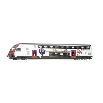 Double-decker train of the Swiss Federal Railways with a colourfully painted exterior, depicting a bird and a lion. Doors and windows clearly visible.