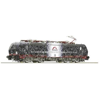 A locomotive with a striking black design, featuring the text 'We're bringing the power of 30 horses to the railway track'.