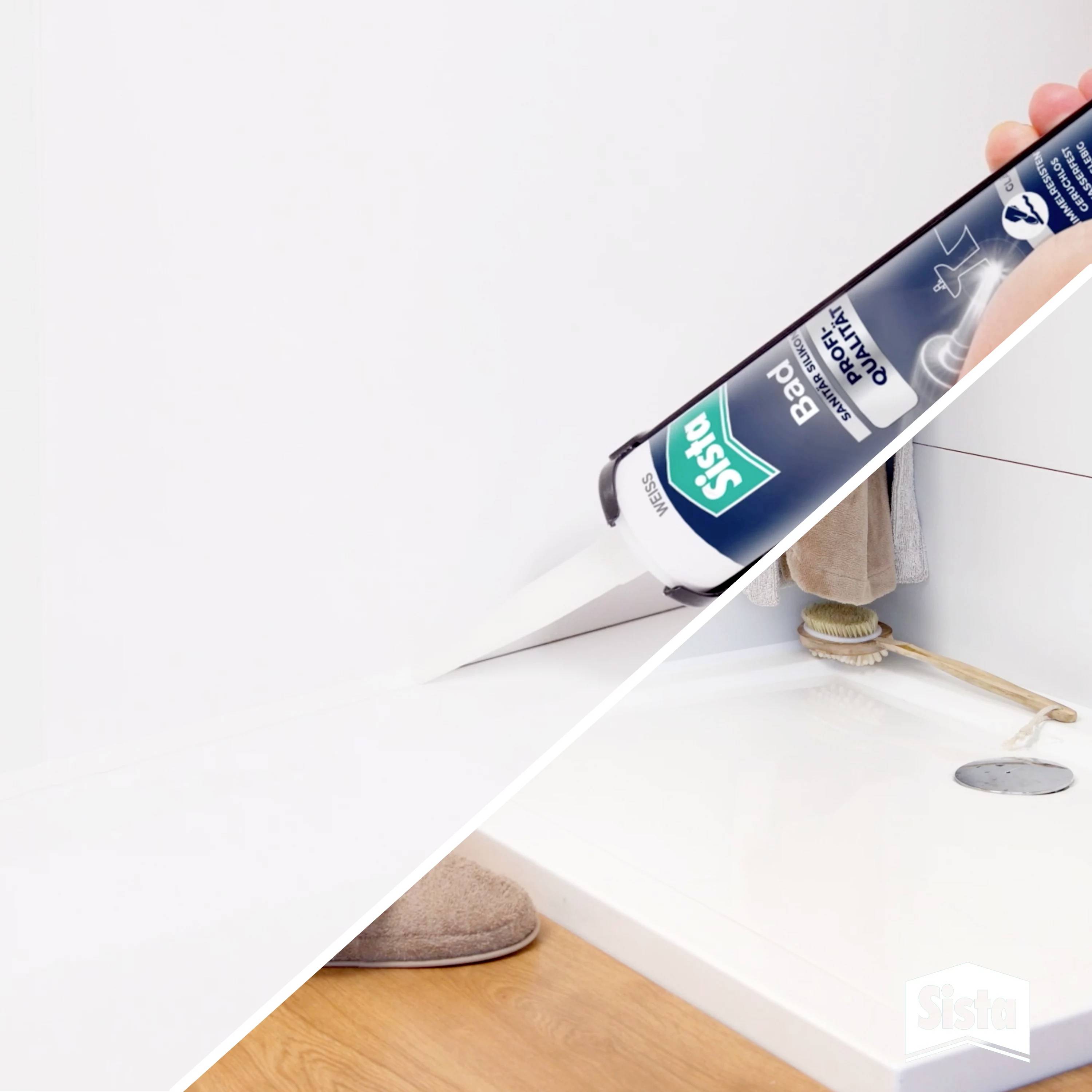 A person is using a silicone cartridge to seal joints in a bathroom. The focus is on precision during application.