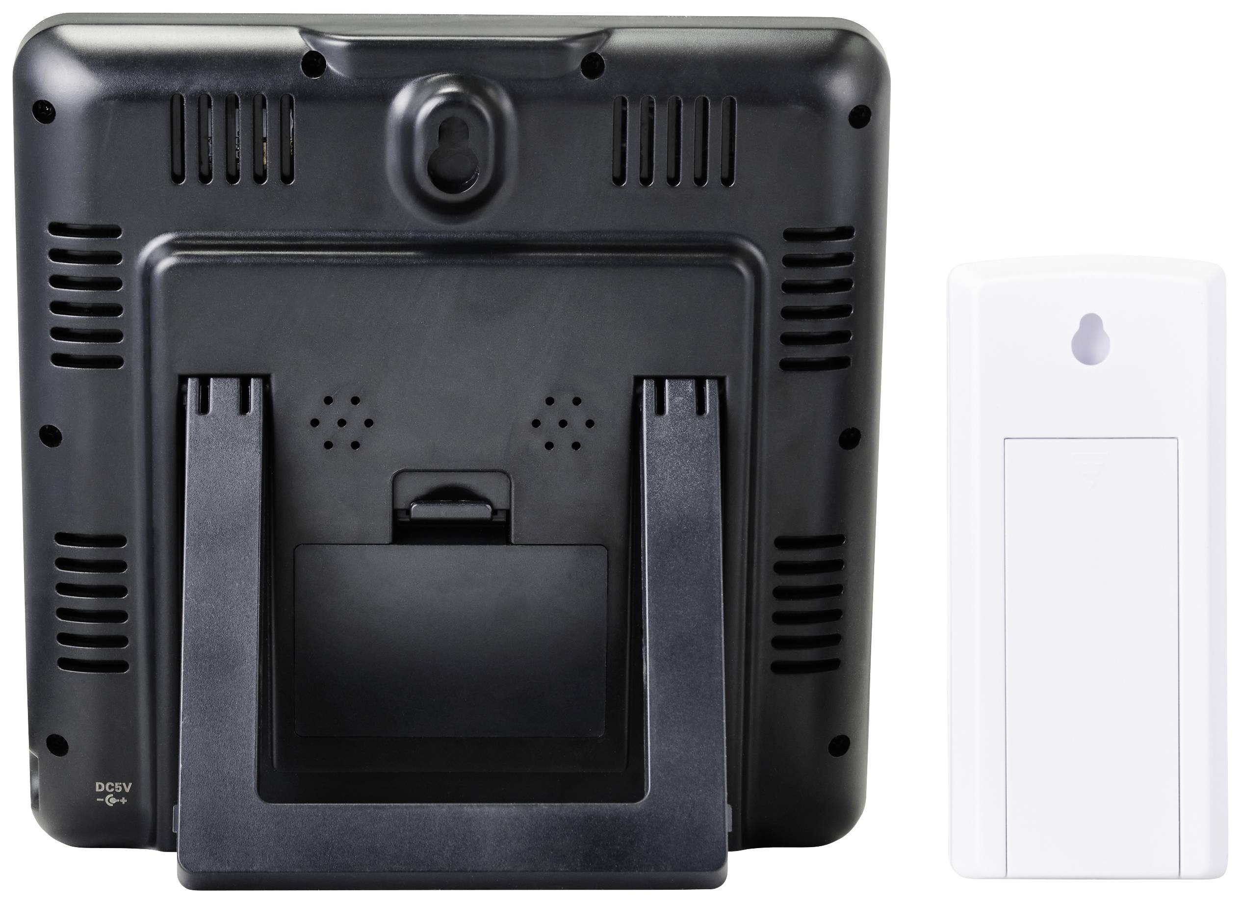 Rear view of a black digital photo frame with a stand, next to a white rectangular device. Both objects on a white background.