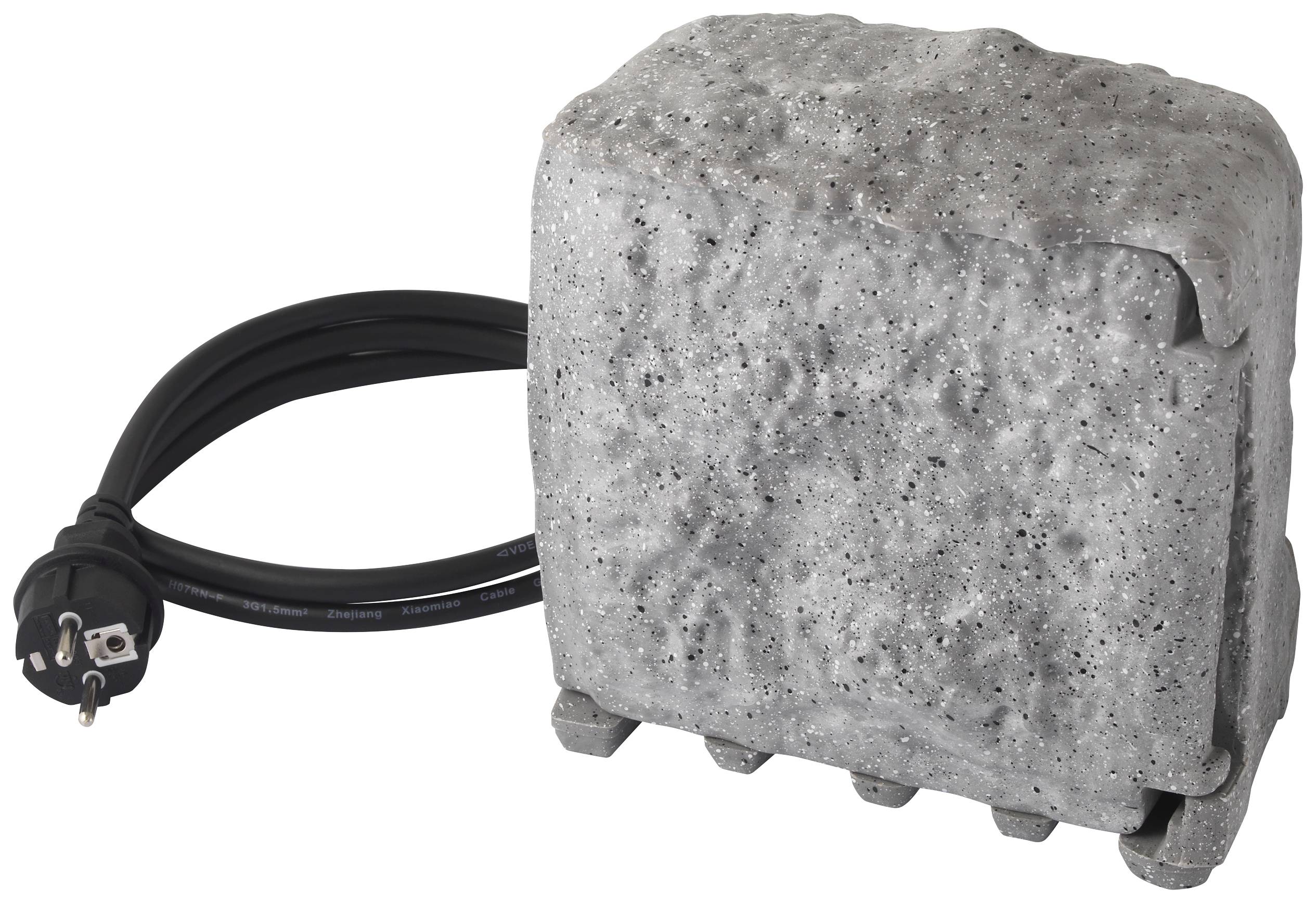 A grey concrete block with a black electrical cable connection. The concrete block has an irregular, rough surface.