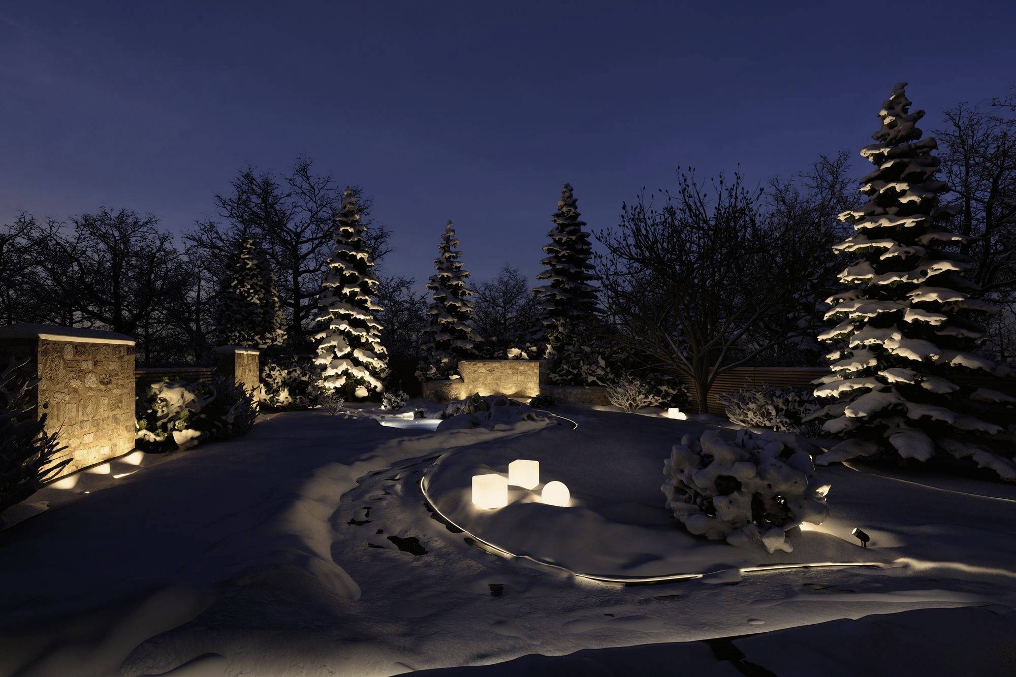 Snow-covered garden at night with illuminated cubes on the ground and lit-up fir trees, creating a serene winter atmosphere.
