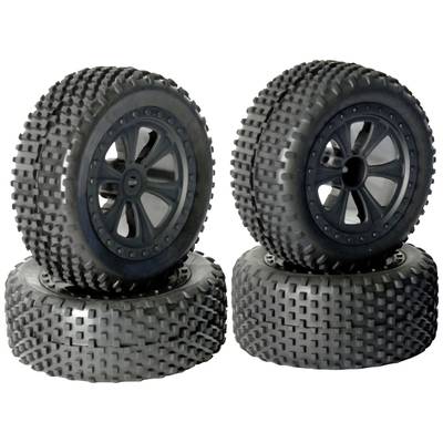 Four chunky tyres for remote-controlled off-road vehicles, two standing upright and two lying in the background.