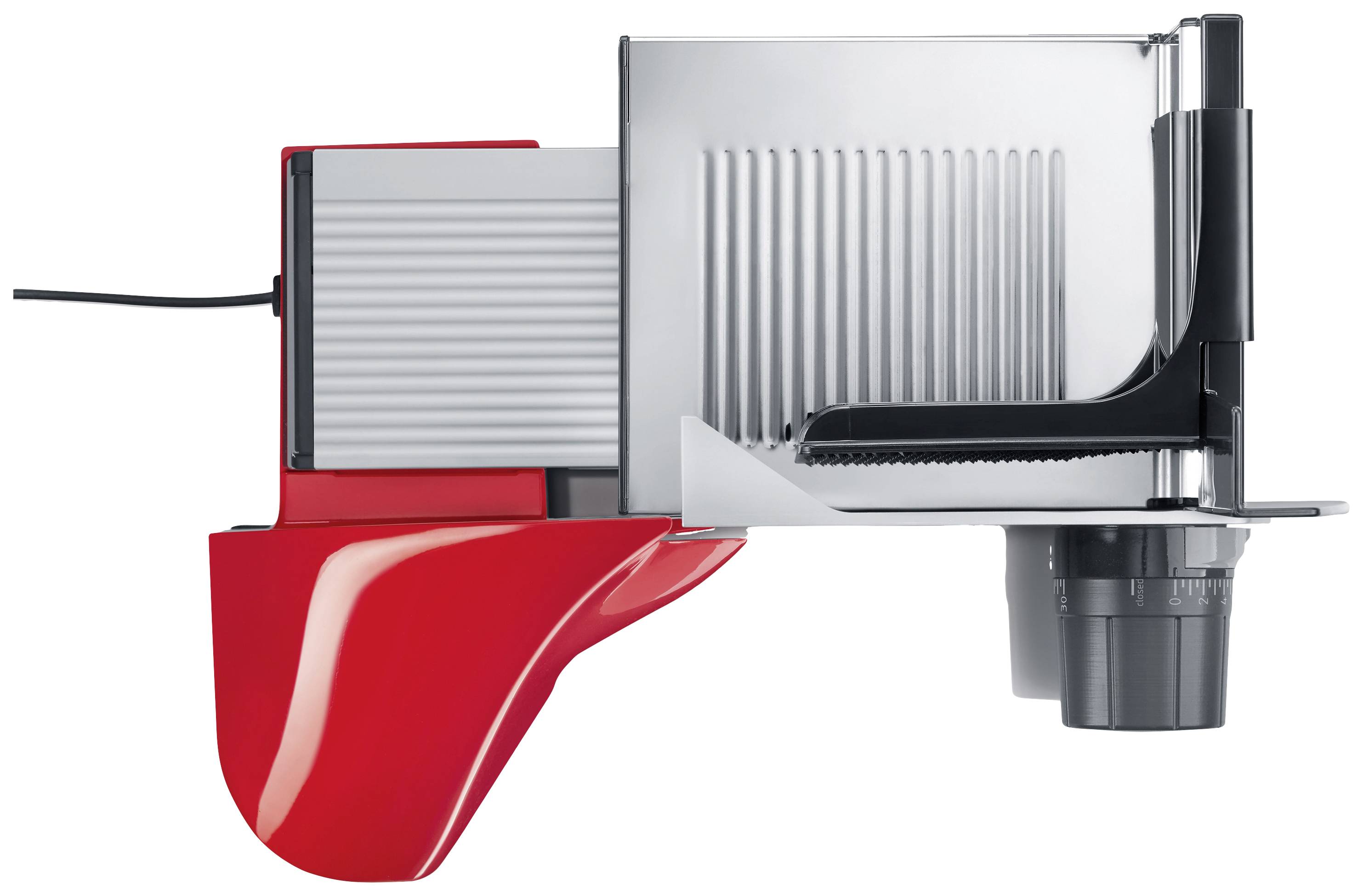 Electric red bread slicing machine viewed from the side. The machine has a silver casing and a serrated blade.