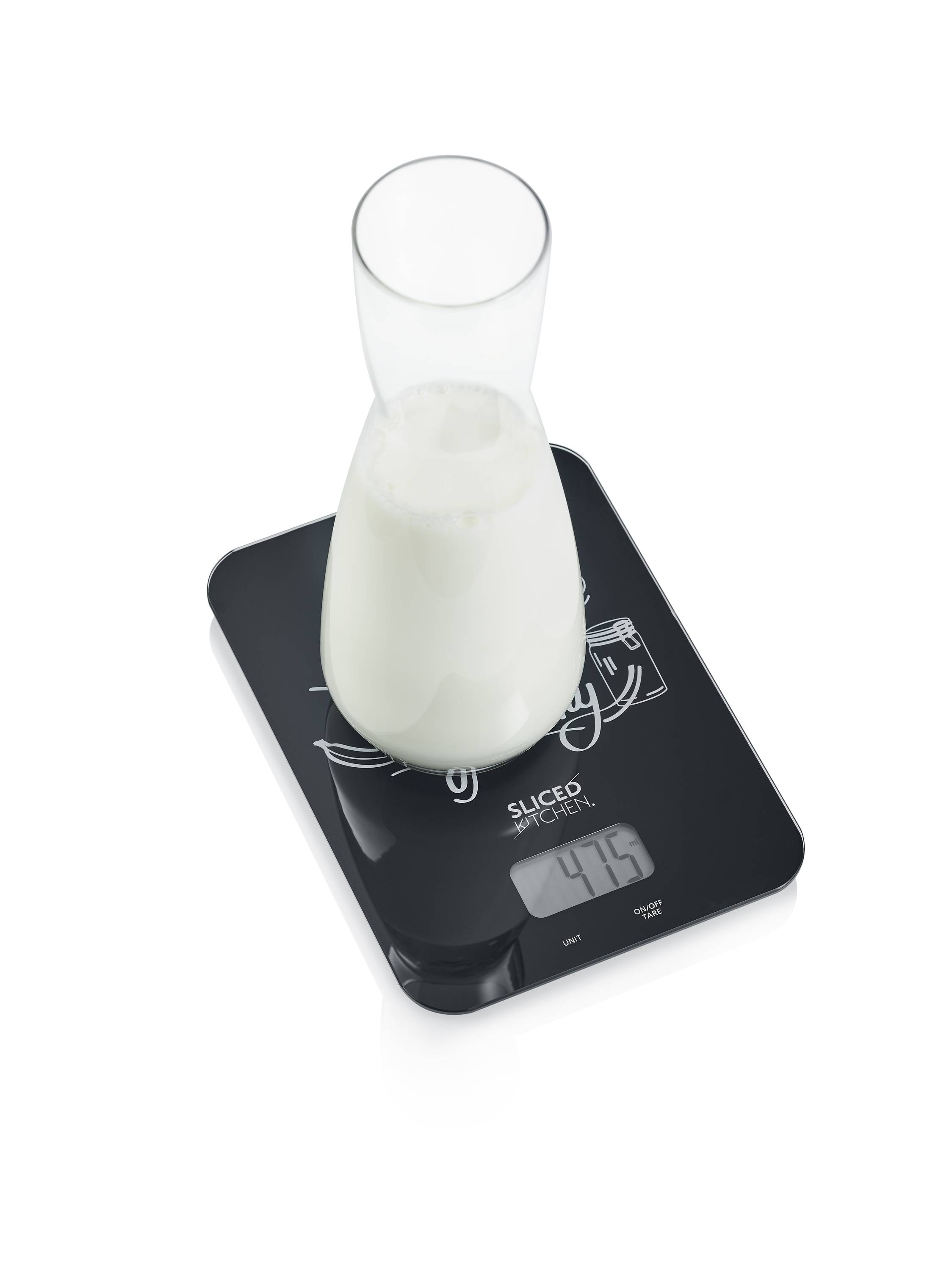 Digital kitchen scales with a glass container full of milk, displaying 475 grams on the screen.