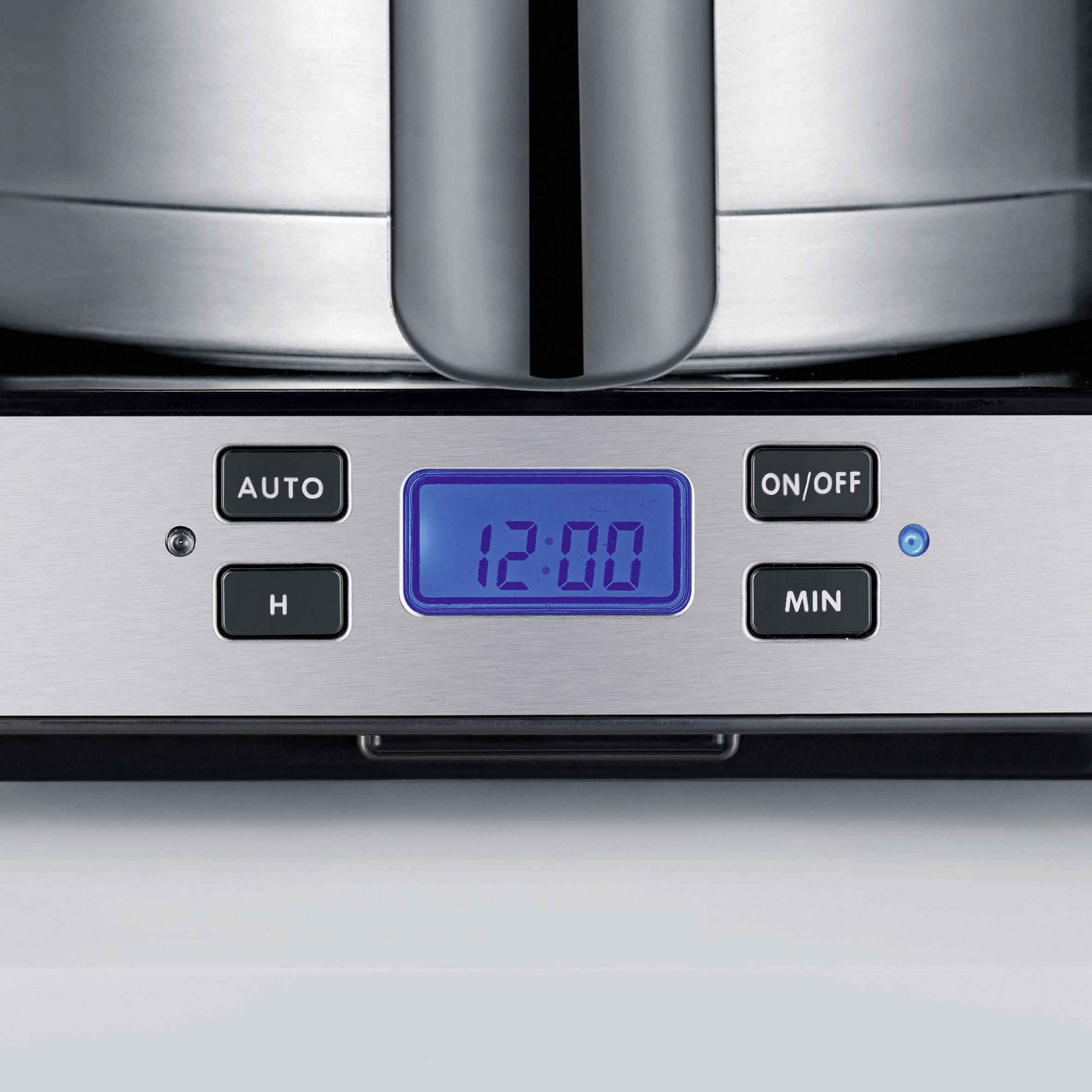 Digital clock on stainless steel coffee machine displays "12:00". Buttons for auto, hours, on/off and minutes are visible.