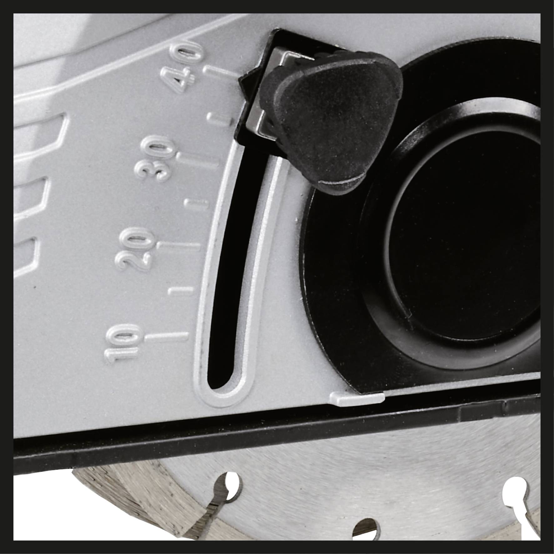 Close-up of an angle adjustment dial on a circular saw with a scale from 0 to 45 degrees, showing a pivoting mechanism for cut angle setting.