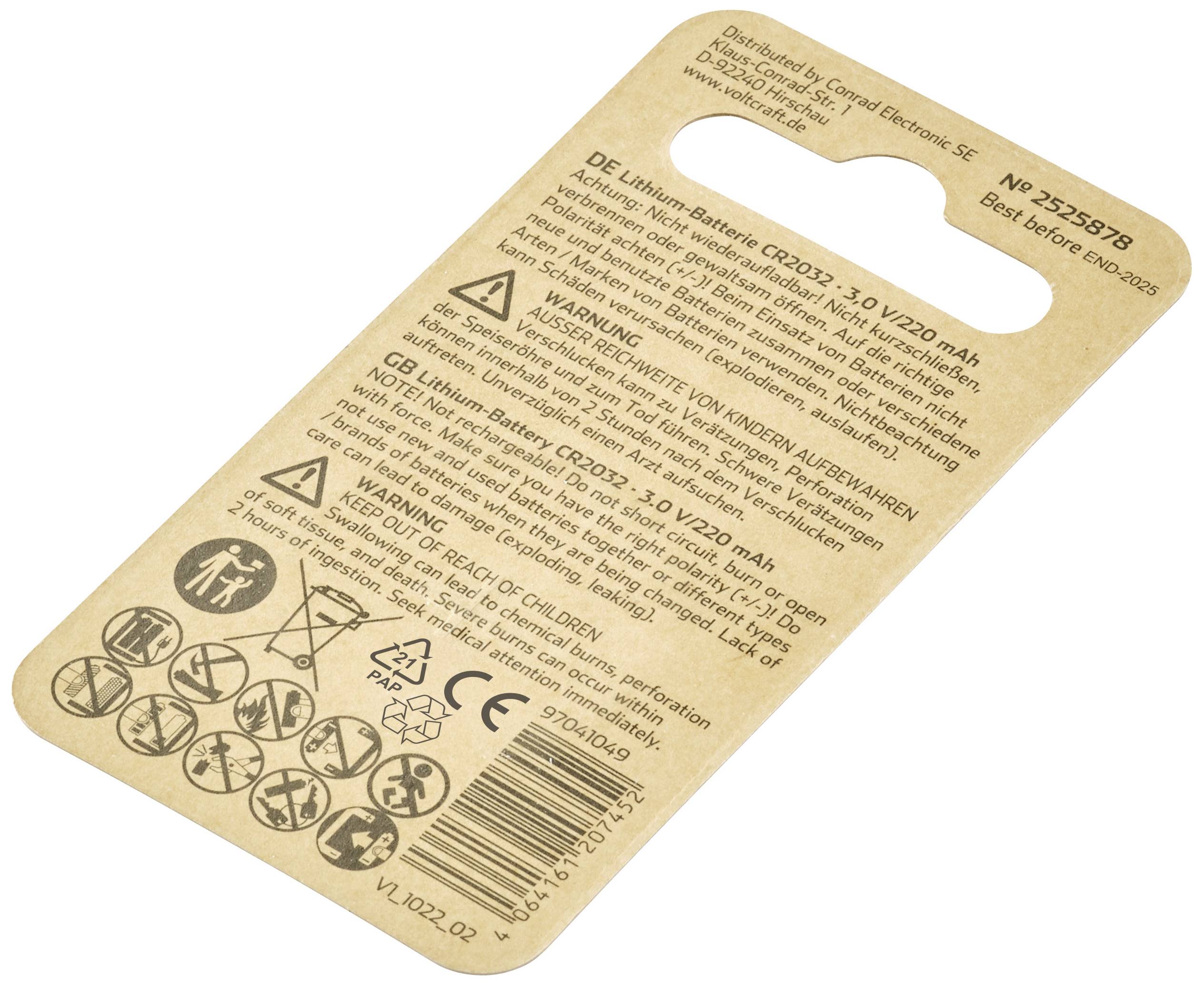 'Rear packaging of button cell batteries with safety instructions, brand name, model number CR2032 and recycling symbols.'