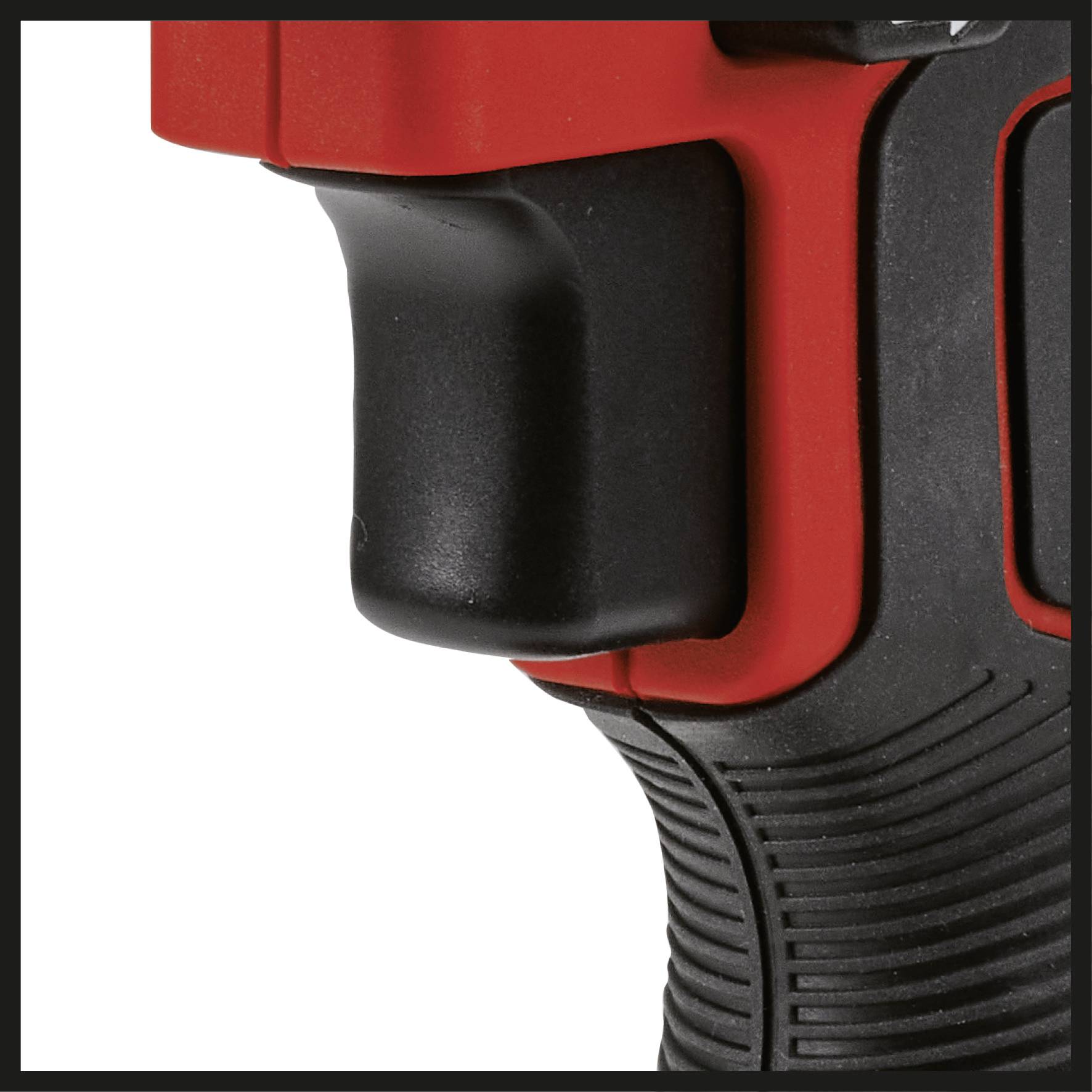 Close-up of a black and red handle of an electric tool, possibly a drill or screwdriver.
