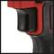 Close-up of a black and red handle of an electric tool, possibly a drill or screwdriver.