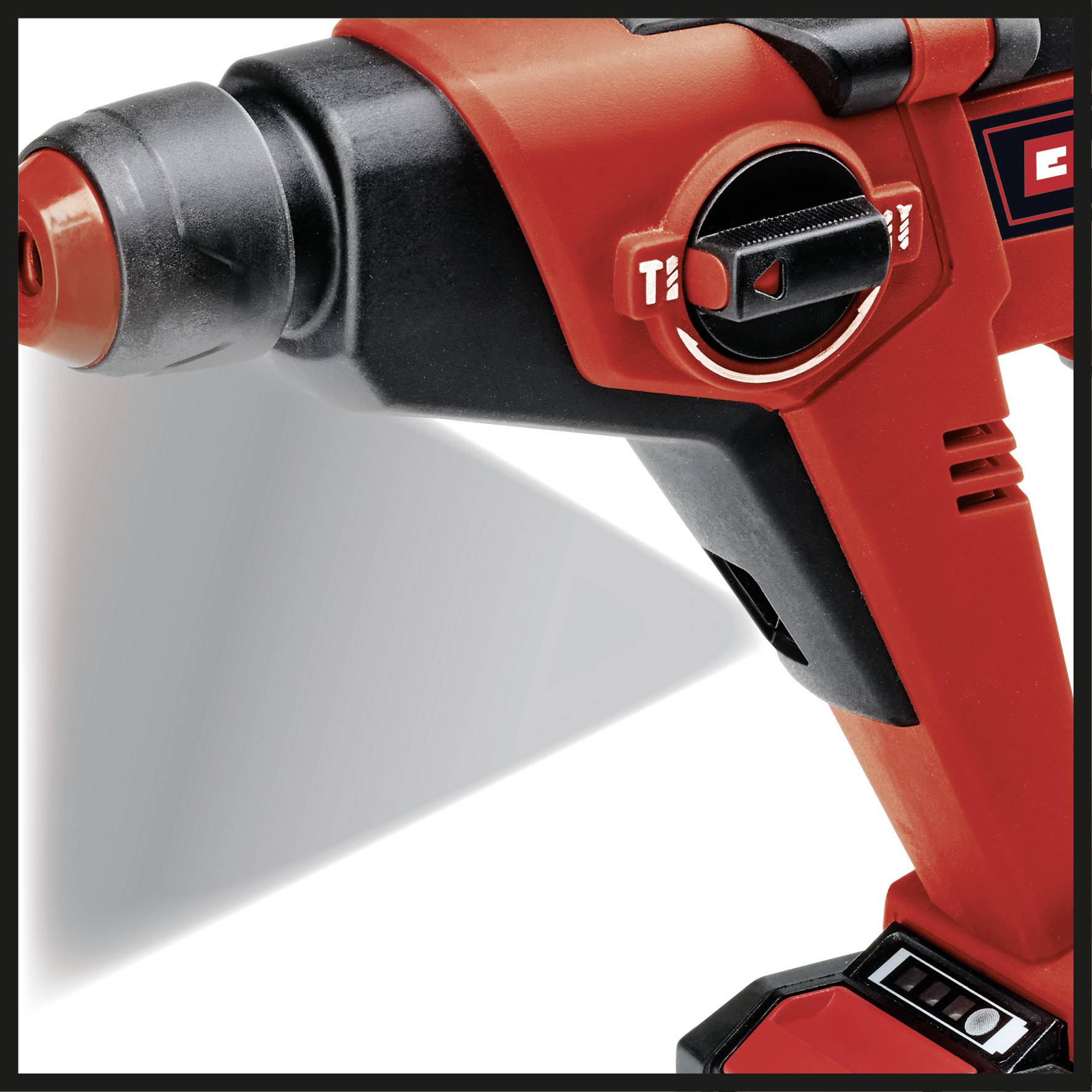 Cordless drill in close-up, red casing, side controls visible.