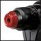 A red and black drill chuck of an electric drill, close-up.