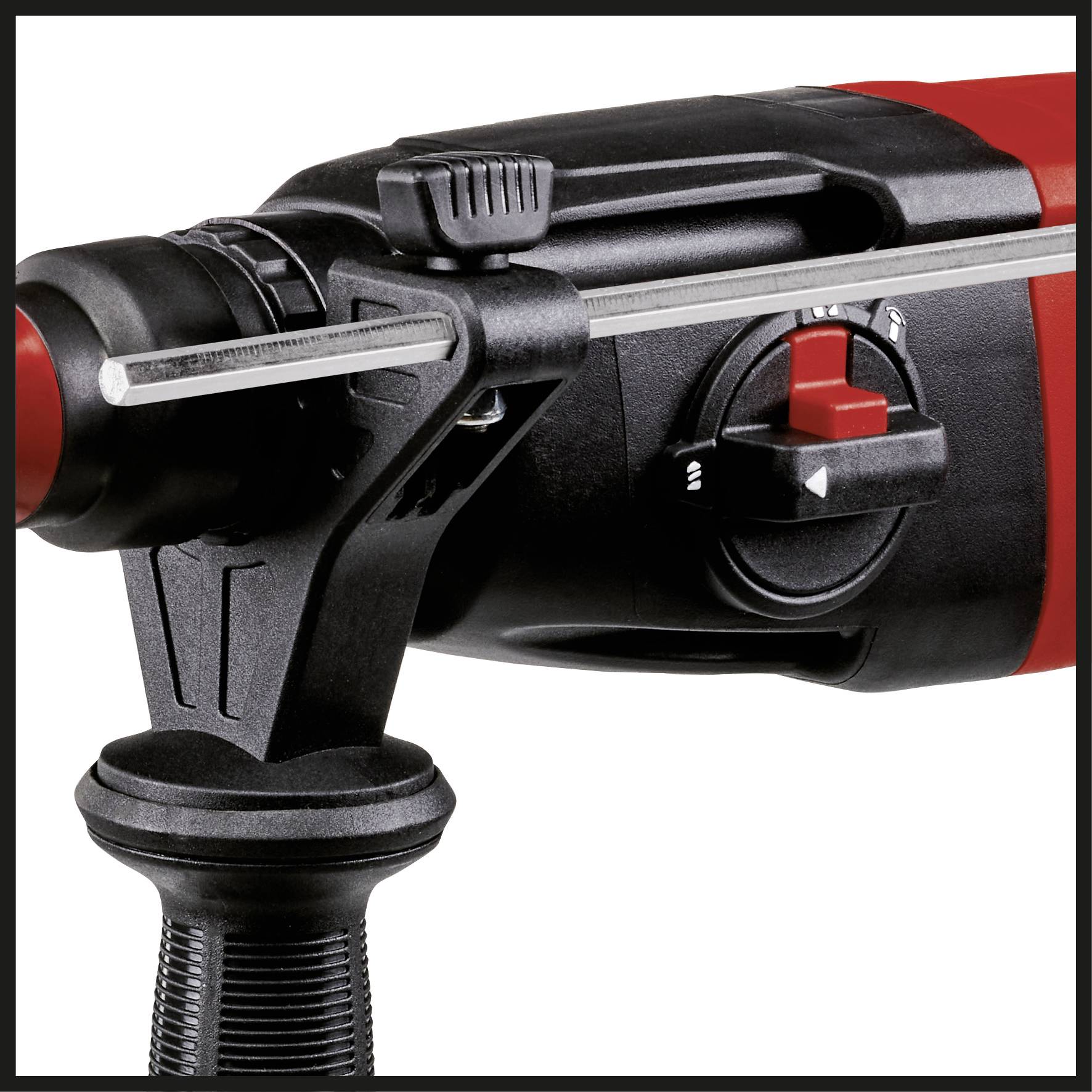 Close-up of a power drill with speed control and a black handle, focused on a metallic point.