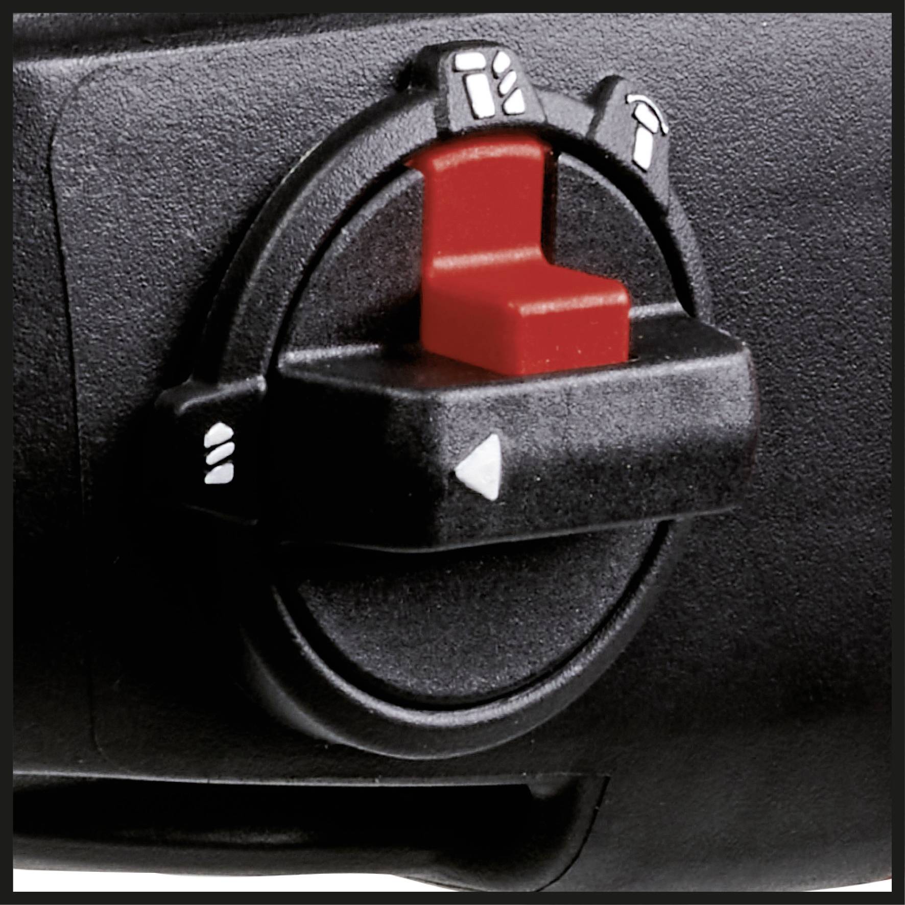 Close-up of a rotary switch with a red handle on a black device, featuring symbols for various settings and an arrow.