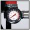 Close-up of a pressure gauge on a pipe, showing a reading around 2 bar or 30 psi.<br>