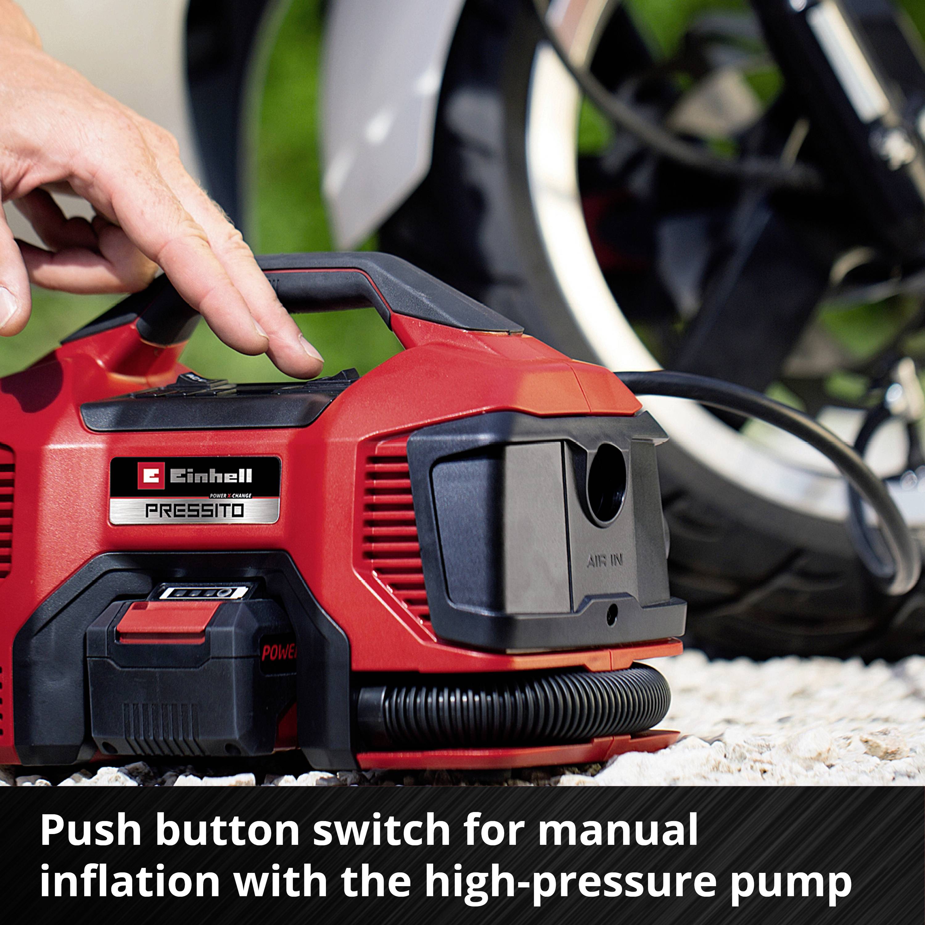A person is operating a red compressor with a black lever. Text: 'Push-button switch for manual inflation using the high-pressure pump'.