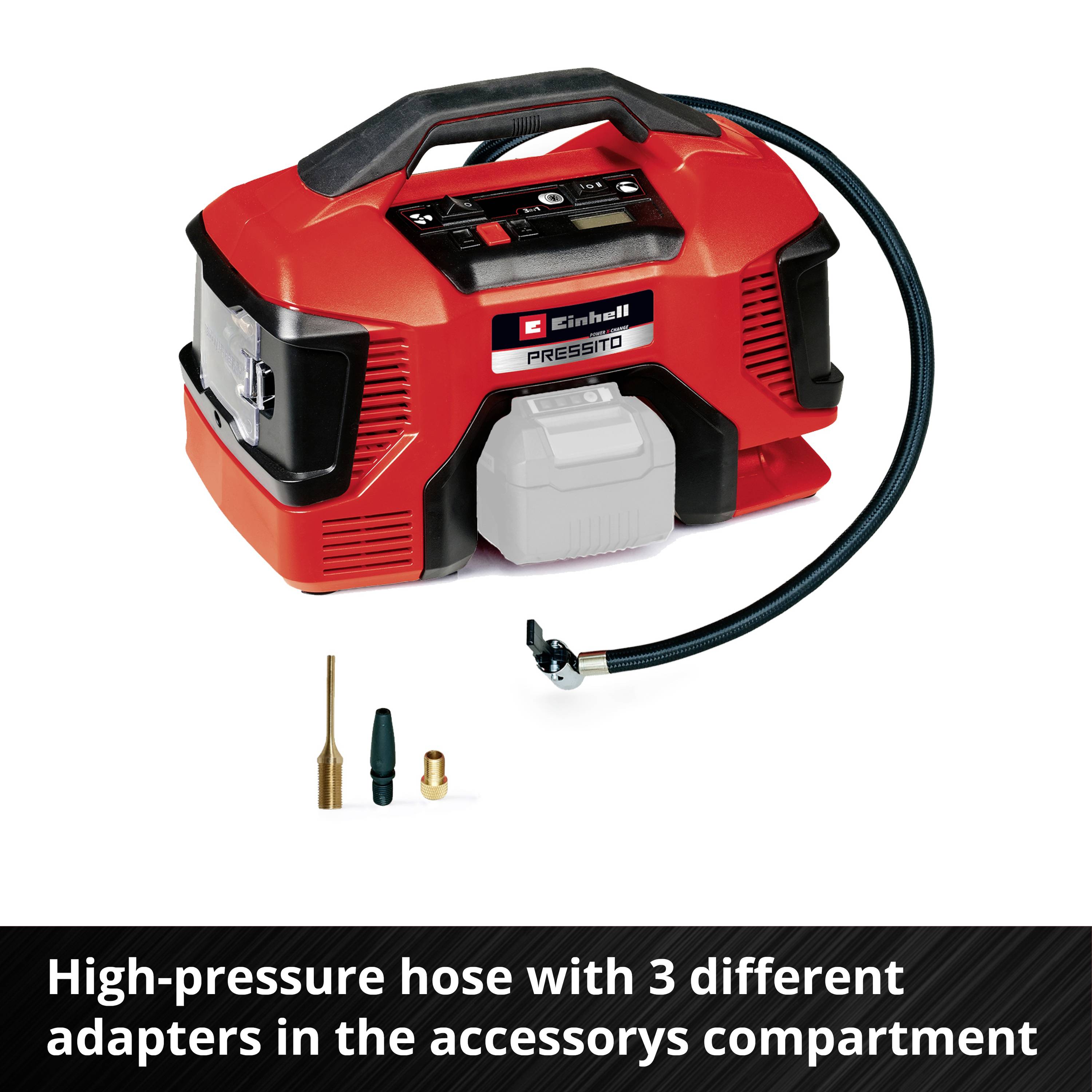 A red air compressor with three different adapter types in the accessory compartment.