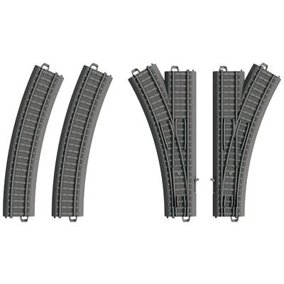 Toy train tracks: two curved rails, a simple points and a split points. They are made of grey plastic.