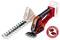A red, cordless garden cutting tool with two interchangeable blade attachments: one for grass, one for shrubs.